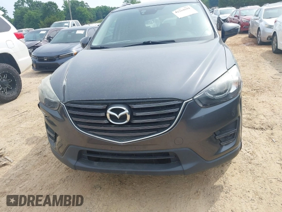 2016 Mazda CX-5 Grand Touring z VIN JM3KE2DY5G0801238, wystawiony jako IAAI lot #42264694 z przebiegiem 136 993 mil mil oraz . Historia ofert i sprzedaży dostępna na DreamBid. Obrazek 11.