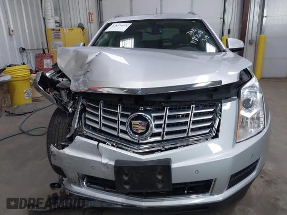 2014 Cadillac SRX Luxury Collection z VIN 3GYFNEE36ES679505, wystawiony jako IAAI lot #41817608 z przebiegiem 62 351 mil mil oraz . Historia ofert i sprzedaży dostępna na DreamBid. Obrazek 17.