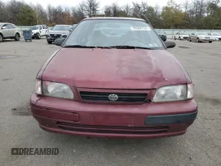 1995 Toyota Tercel DX z VIN JT2EL56E4S0101986, wystawiony jako Copart lot #76588734 z przebiegiem 204 800 mil mil oraz Czysty tytuł • Clean title. Historia ofert i sprzedaży dostępna na DreamBid. Obrazek 5.