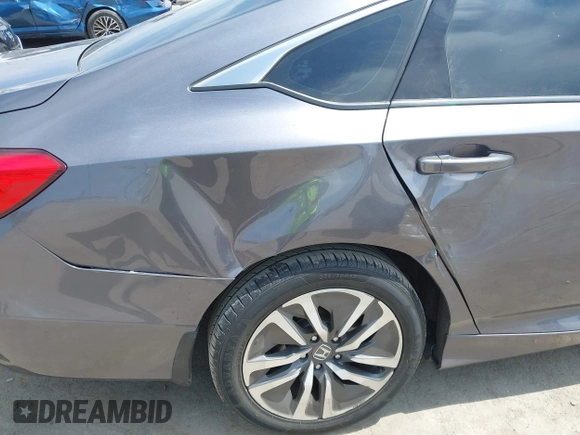2020 Honda Accord with VIN 1HGCV3F11LA015901, listed as a IAAI auction lot 42022659 with 131,865 mi miles and . Bid and sale history available at DreamBid. Image 6.