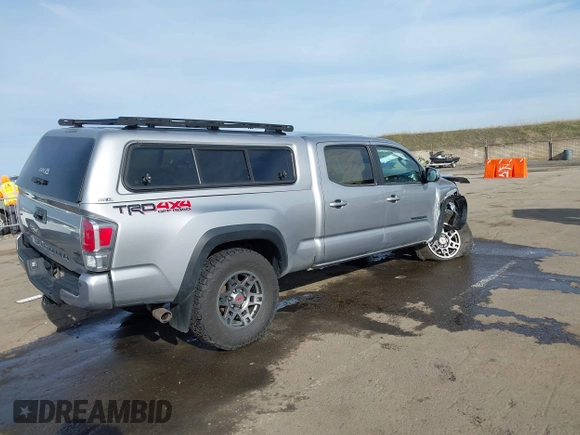 2021 Toyota Tacoma 4WD SR5 with VIN 3TMDZ5BN1MM105694, listed as a IAAI auction lot 41233853 with 1 mi miles. Bid and sale history available at carsss.com. Image 4.
