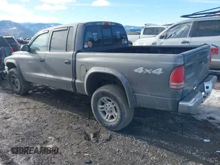 2004 Dodge Dakota SLT with VIN 1D7HG48N44S701906, listed as a IAAI auction lot 41662483 with 202,575 mi miles and . Bid and sale history available at carsss.com. Image 3.