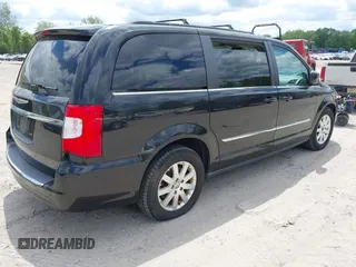2014 Chrysler Town & Country Touring with VIN 2C4RC1BG2ER206979, listed as a IAAI auction lot 42200266 with 217,610 mi miles and . Bid and sale history available at DreamBid. Image 4.