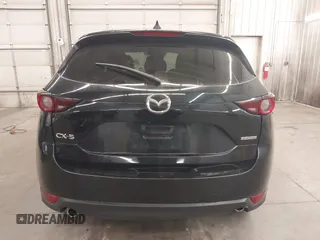 2020 Mazda CX-5 Touring with VIN JM3KFBCM9L1785125, listed as a IAAI auction lot 41983561 with 101,062 mi miles and . Bid and sale history available at carsss.com. Image 17.
