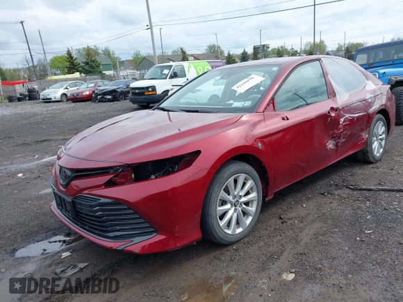 2019 Toyota Camry LE with VIN 4T1B11HK8KU823736, listed as a IAAI auction lot 42166696 with 21,732 mi miles and . Bid and sale history available at DreamBid. Image 18.