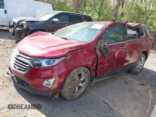 2021 Chevrolet Equinox Premier z VIN 2GNAXNEV7M6140889, wystawiony jako IAAI lot #42039443 z przebiegiem 101 767 mil mil oraz . Historia ofert i sprzedaży dostępna na DreamBid. Obrazek 2.