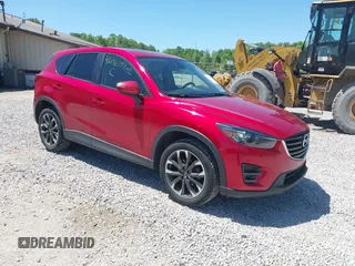 2016 Mazda CX-5 Grand Touring z VIN JM3KE4DY9G0630943, wystawiony jako IAAI lot #42186393 z przebiegiem 166 558 mil mil oraz . Historia ofert i sprzedaży dostępna na DreamBid. Obrazek 1.