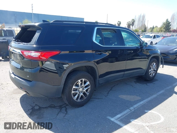 2021 Chevrolet Traverse LT Cloth with VIN 1GNERGKW9MJ162089, listed as a IAAI auction lot 41944248 with 99,586 mi miles. Bid and sale history available at carsss.com. Image 4.