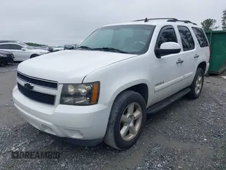 2007 Chevrolet Tahoe LT with VIN 1GNFC13007R415013, listed as a IAAI auction lot 42370633 with 302,992 mi miles and . Bid and sale history available at DreamBid. Image 2.
