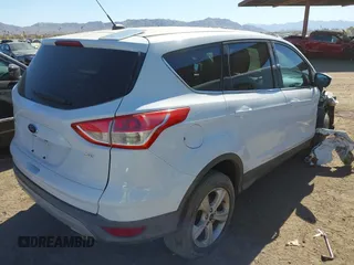 2015 Ford Escape SE with VIN 1FMCU0G7XFUA52818, listed as a IAAI auction lot 41679303 with 127,098 mi miles. Bid and sale history available at carsss.com. Image 4.