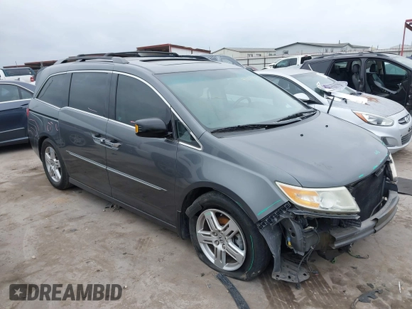2012 Honda Odyssey Touring with VIN 5FNRL5H96CB138548, listed as a IAAI auction lot 41471856 with 186,284 mi miles and . Bid and sale history available at DreamBid. Image 1.