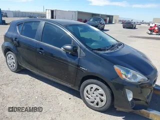 2016 Toyota Prius One z VIN JTDKDTB31G1122487, wystawiony jako IAAI lot #41866418 z przebiegiem 74 035 mil mil oraz . Historia ofert i sprzedaży dostępna na DreamBid. Obrazek 1.
