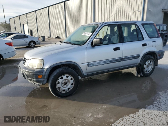 1999 Honda CR-V LX with VIN JHLRD2844XC016583, listed as a Copart auction lot 73747274 with 104,730 mi miles and Salvage Title. Bid and sale history available at carsss.com. Image 1.