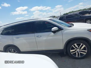 2017 Honda Pilot Touring with VIN 5FNYF6H92HB054145, listed as a IAAI auction lot 42200391 with 70,096 mi miles and . Bid and sale history available at DreamBid. Image 13.