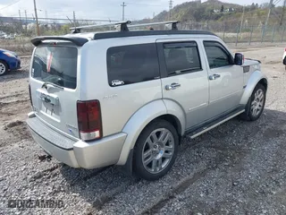 2011 Dodge Nitro Heat with VIN 1D4PU4GKXBW598683, listed as a IAAI auction lot 41958182 with 167,114 mi miles. Bid and sale history available at carsss.com. Image 4.
