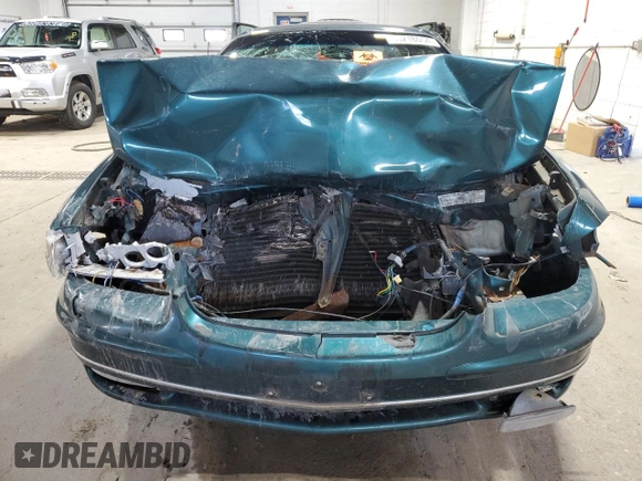 1997 Buick Regal LS with VIN 2G4WB52K0V1442719, listed as a Copart auction lot 80218054 with 0 mi miles and Salvage Title. Bid and sale history available at carsss.com. Image 5.