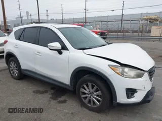 2016 Mazda CX-5 Touring z VIN JM3KE2CY7G0674218, wystawiony jako IAAI lot #42174457 z przebiegiem 174 091 mil mil oraz . Historia ofert i sprzedaży dostępna na DreamBid. Obrazek 1.