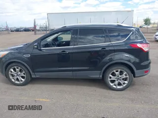 2014 Ford Escape Titanium with VIN 1FMCU9JX2EUB66579, listed as a IAAI auction lot 42171374 with 131,485 mi miles. Bid and sale history available at carsss.com. Image 14.
