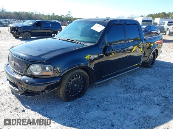 2002 Ford F-150 Harley Davidson with VIN 1FTRW07312KC24102, listed as a IAAI auction lot 41591917 with 1 mi miles. Bid and sale history available at carsss.com. Image 2.