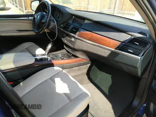 2012 BMW X5 35i с VIN 5UXZV4C5XCL749123, выставлен на аукционе IAAI как лот 41749728 с пробегом 124 193 миль миль и . История ставок и продаж доступна на DreamBid. Изображение 5.