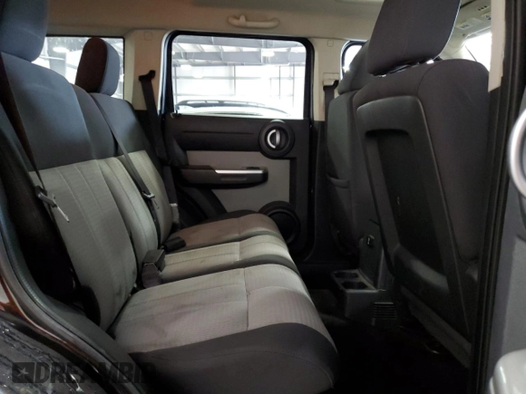 2008 Dodge Nitro SLT z VIN 1D8GU58KX8W206104, wystawiony jako Copart lot #71740974 z przebiegiem 236 981 mil mil oraz Szkoda całkowita • Salvage title. Historia ofert i sprzedaży dostępna na DreamBid. Obrazek 11.