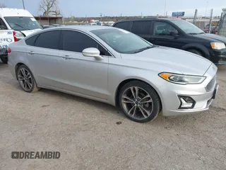 2019 Ford Fusion Titanium with VIN 3FA6P0D93KR210907, listed as a IAAI auction lot 41725001 with 102,899 mi miles and . Bid and sale history available at DreamBid. Image 1.