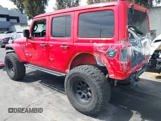 2019 Jeep Wrangler Unlimited Sahara with VIN 1C4HJXEN0KW552028, listed as a IAAI auction lot 41934634 with 53,054 mi miles and . Bid and sale history available at DreamBid. Image 3.