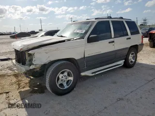 1996 Jeep Grand Cherokee Laredo with VIN 1J4FX58S6TC194152, listed as a Copart auction lot 62114165 with 50,956 mi miles and Salvage title. Bid and sale history available at DreamBid. Image 1.