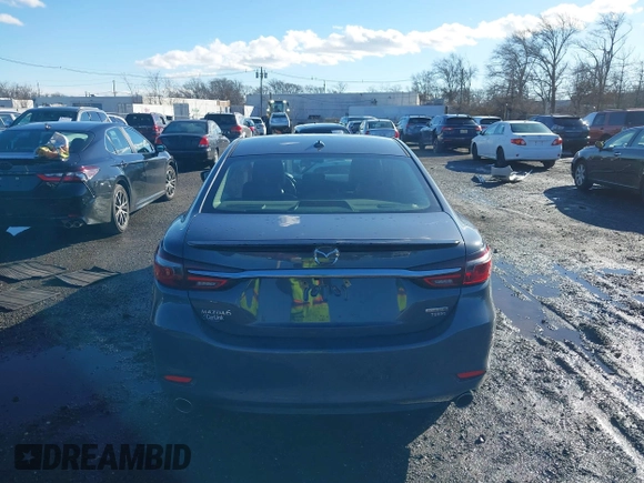 2021 Mazda 6 Carbon Edition with VIN JM1GL1WY3M1603064, listed as a IAAI auction lot 41199852 with 118,307 mi miles and . Bid and sale history available at DreamBid. Image 16.