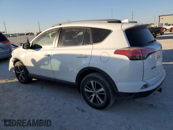2018 Toyota RAV4 XLE with VIN JTMWFREV7JJ742974, listed as a Copart auction lot 41957735 with 87,005 mi miles and Salvage Title. Bid and sale history available at DreamBid. Image 2.