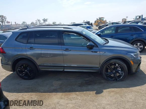 2023 Volkswagen Tiguan SE R-Line Black with VIN 3VVCB7AX8PM036684, listed as a IAAI auction lot 42169004 with 25,024 mi miles and . Bid and sale history available at DreamBid. Image 12.