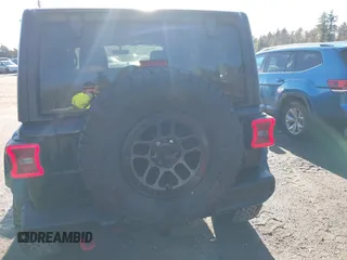 2023 Jeep Wrangler Rubicon with VIN 1C4JJXFGXPW682231, listed as a IAAI auction lot 41110264 with 15,147 mi miles and . Bid and sale history available at DreamBid. Image 16.