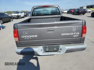 2003 Dodge Dakota with VIN 1D7FL16X13S189963, listed as a Copart auction lot 77114344 with 100,127 mi miles and Salvage Title. Bid and sale history available at carsss.com. Image 6.