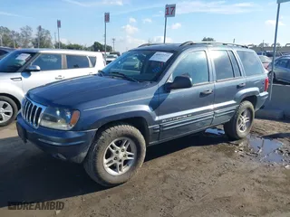2002 Jeep Grand Cherokee Laredo with VIN 1J4GW48N72C261741, listed as a IAAI auction lot 40972222 with 174,516 mi miles. Bid and sale history available at carsss.com. Image 2.