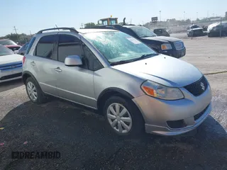 2010 Suzuki SX4 with VIN JS2YA5A30A6301412, listed as a IAAI auction lot 40599958 with 123,177 mi miles. Bid and sale history available at carsss.com. Image 1.