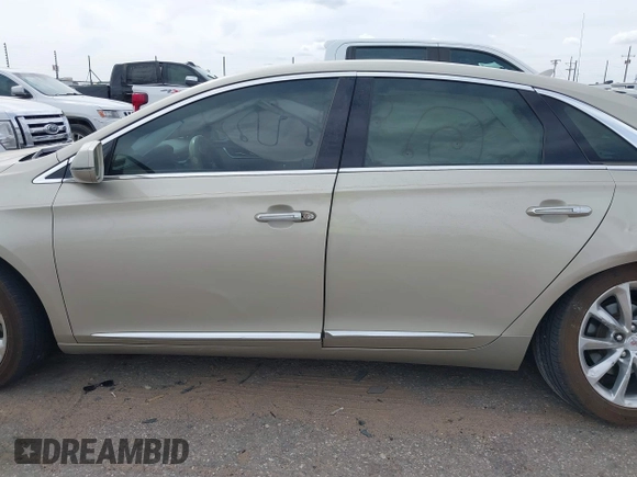 2013 Cadillac XTS Luxury with VIN 2G61P5S30D9132193, listed as a IAAI auction lot 41897709 with 140,780 mi miles and . Bid and sale history available at DreamBid. Image 14.