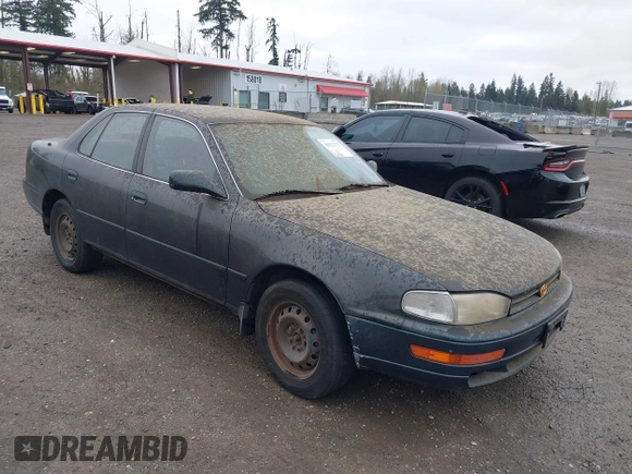1994 Toyota Camry LE z VIN JT2GK12E1R0036423, wystawiony jako IAAI lot #41922375 z przebiegiem 211 529 mil mil oraz . Historia ofert i sprzedaży dostępna na DreamBid. Obrazek 1.