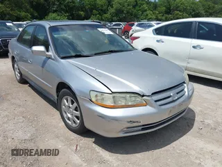 2002 Honda Accord SE z VIN JHMCG56732C008703, wystawiony jako IAAI lot #42450282 z przebiegiem 309 336 mil mil oraz . Historia ofert i sprzedaży dostępna na DreamBid. Obrazek 1.