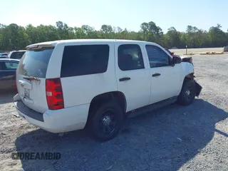 2011 Chevrolet Tahoe Commercial with VIN 1GNLC2E04BR293125, listed as a IAAI auction lot 42476037 with 123,666 mi miles and . Bid and sale history available at DreamBid. Image 4.