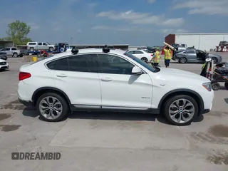 2018 BMW X4 xDrive28i z VIN 5UXXW3C52J0T82067, wystawiony jako IAAI lot #42032671 z przebiegiem 101 331 mil mil oraz . Historia ofert i sprzedaży dostępna na DreamBid. Obrazek 13.