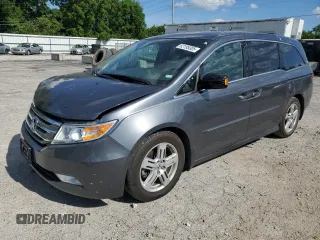 2013 Honda Odyssey Touring with VIN 5FNRL5H92DB003715, listed as a Copart auction lot 62195305 with 97,246 mi miles and Salvage title. Bid and sale history available at DreamBid. Image 1.