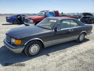 1987 Mercedes-Benz 560 with VIN WDBCA45D3HA358923, listed as a Copart auction lot 52143895 with 127,974 mi miles and Clean Title. Bid and sale history available at DreamBid. Image 1.
