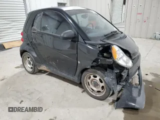 2011 Smart fortwo Pure с VIN WMEEJ3BA5BK480412, выставлен на аукционе Copart как лот 87023194 с пробегом 70 496 миль миль и Списание • Salvage title. История ставок и продаж доступна на DreamBid. Изображение 4.