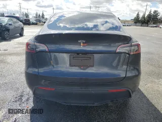 2024 Tesla Model Y z VIN 7SAYGDED1RF089192, wystawiony jako Copart lot #48752085 z przebiegiem 7 643 mil mil oraz Szkoda całkowita • Salvage title. Historia ofert i sprzedaży dostępna na DreamBid. Obrazek 6.