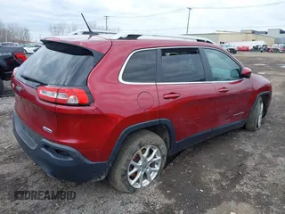 2014 Jeep Cherokee Latitude with VIN 1C4PJMCS0EW261021, listed as a IAAI auction lot 41986701 with 114,633 mi miles. Bid and sale history available at carsss.com. Image 4.