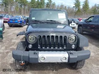 2014 Jeep Wrangler Sport with VIN 1C4AJWAG1EL207860, listed as a IAAI auction lot 41958655 with 138,319 mi miles. Bid and sale history available at carsss.com. Image 12.