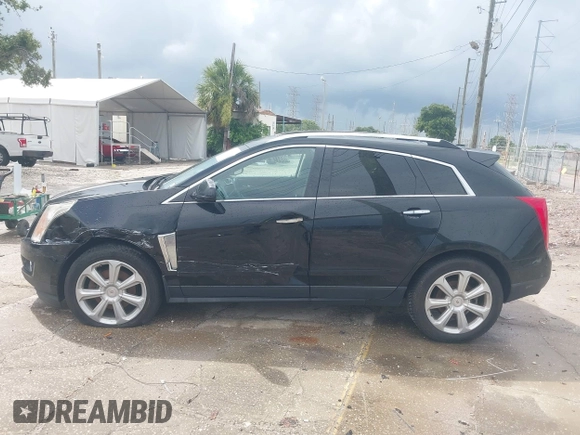 2015 Cadillac SRX Premium Collection with VIN 3GYFNGE30FS634363, listed as a IAAI auction lot 42672064 with 146,821 mi miles and . Bid and sale history available at DreamBid. Image 14.