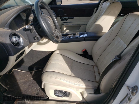 2014 Jaguar XJ with VIN SAJWA2GZ7E8V69543, listed as a Copart auction lot 86390204 with 110,929 mi miles and Salvage Title. Bid and sale history available at carsss.com. Image 7.