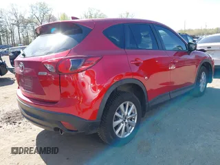 2016 Mazda CX-5 Sport with VIN JM3KE4BY7G0805631, listed as a IAAI auction lot 42028606 with 93,659 mi miles and . Bid and sale history available at carsss.com. Image 4.
