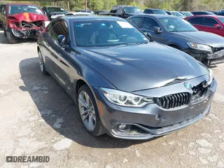 2015 BMW 4 Series 428i xDrive with VIN WBA3N5C55FK484938, listed as a IAAI auction lot 41889907 with 100,439 mi miles. Bid and sale history available at carsss.com. Image 1.
